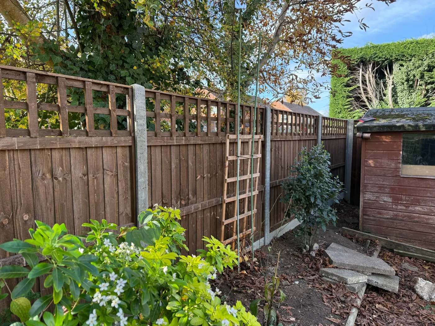 Trellis topped fencing installation in Farnham