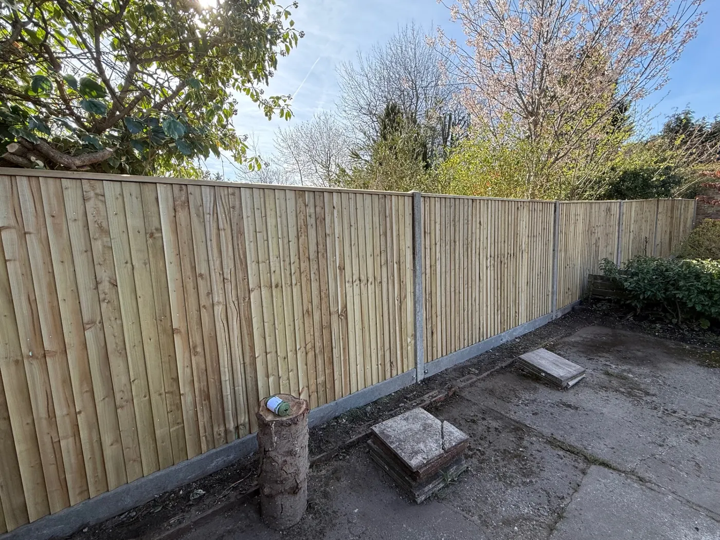 Closeboard fence panels with concrete posts and gravel boards in Farnham